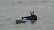 SX08860 Marijn with surfboard at Porth Beach, Newquay.jpg